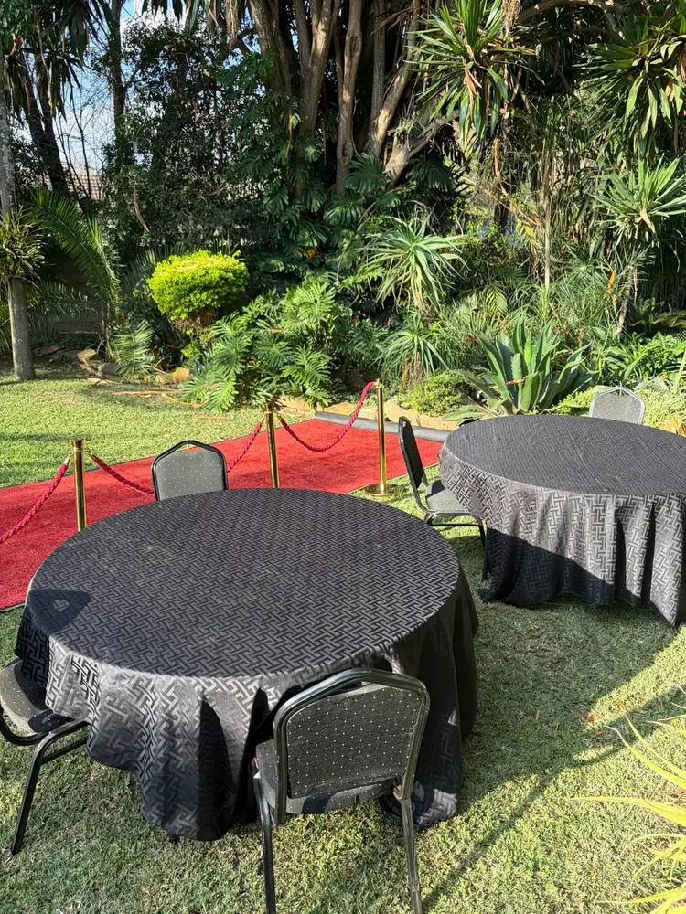 Round black linen tables and chairs