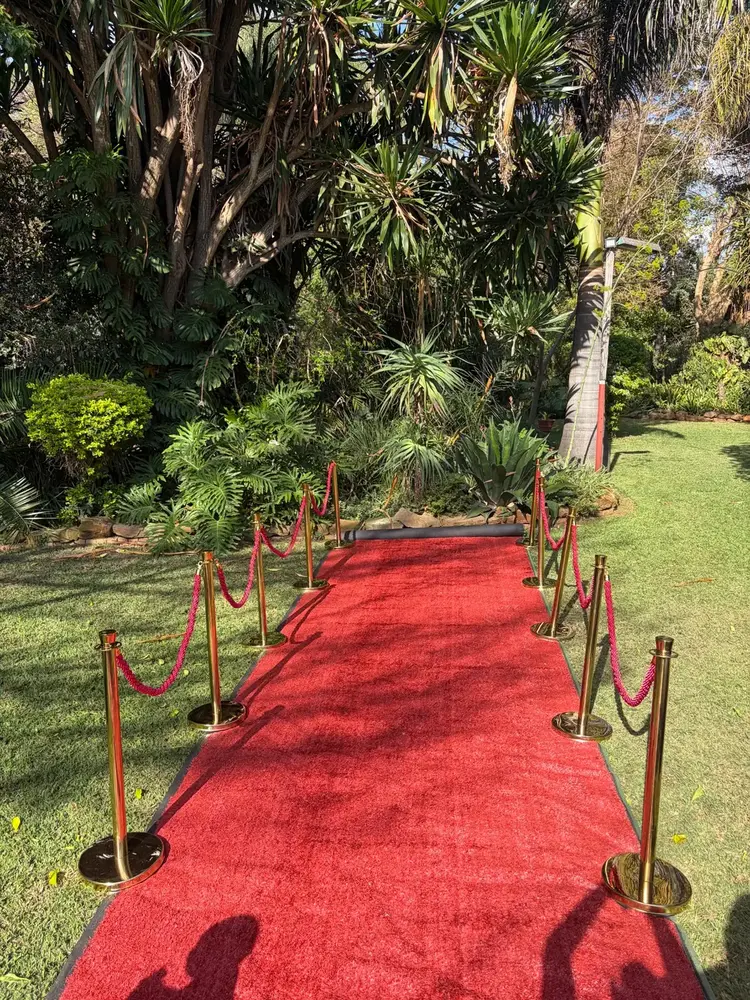Outdoor red carpet entrance setup